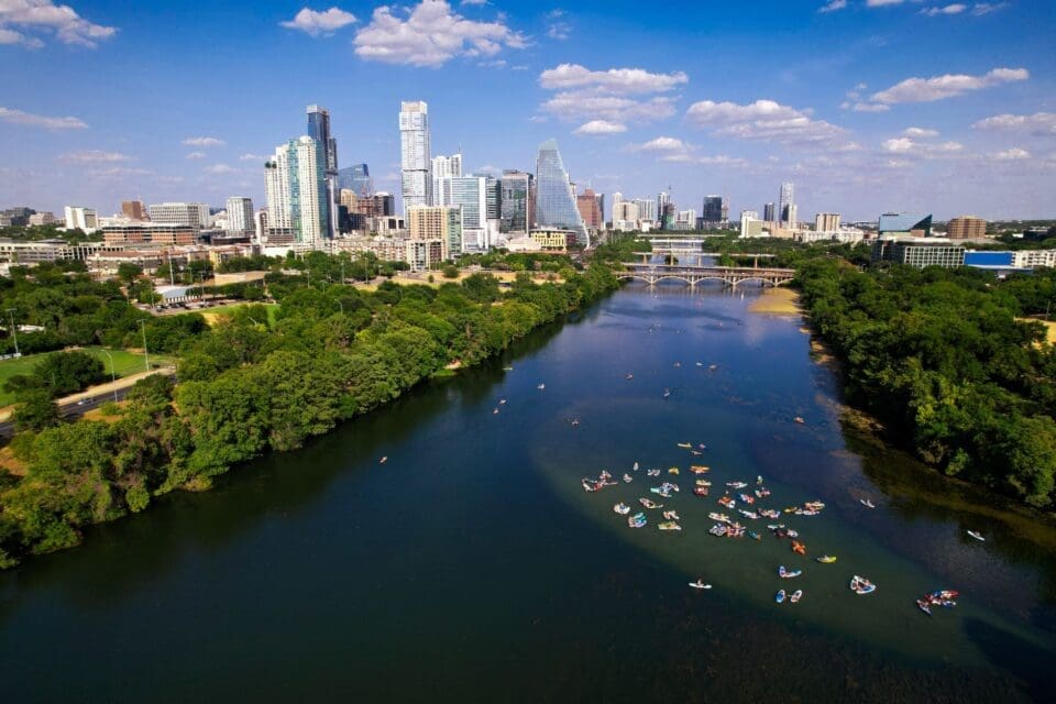 austin with kids — kayaks on the Colorado River with Austin skyline