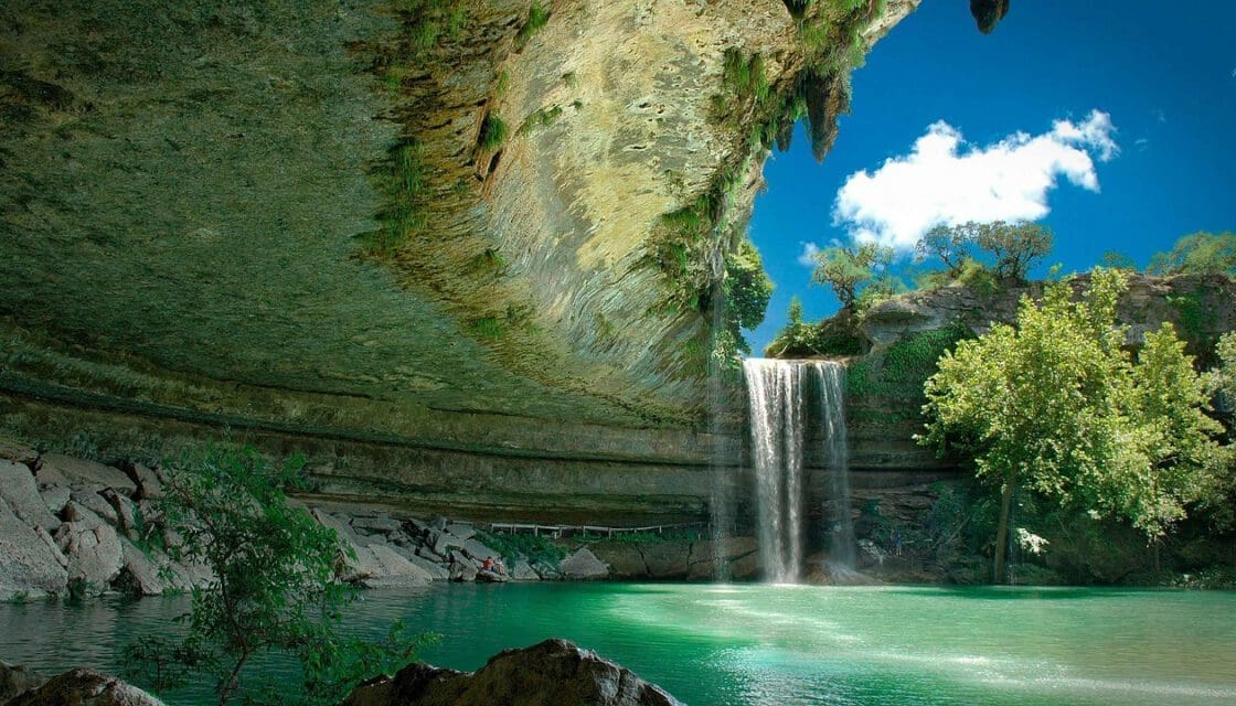 Hamilton Pool Preserve with kids — the iconic waterfall cascading into the natural limestone grotto