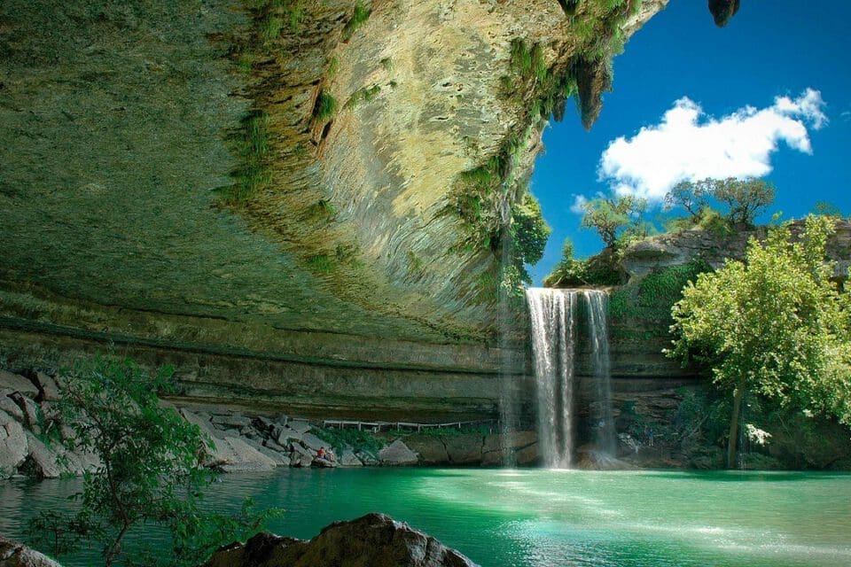 Hamilton Pool Preserve with kids — the iconic waterfall cascading into the natural limestone grotto